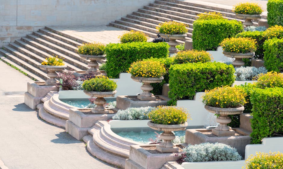 A beautifully designed garden featuring terraced planters and a stone staircase, ideal for landscaping inspiration.